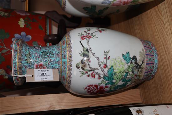 A pair of Chinese famille rose vases and another similar (3) Height 36cm